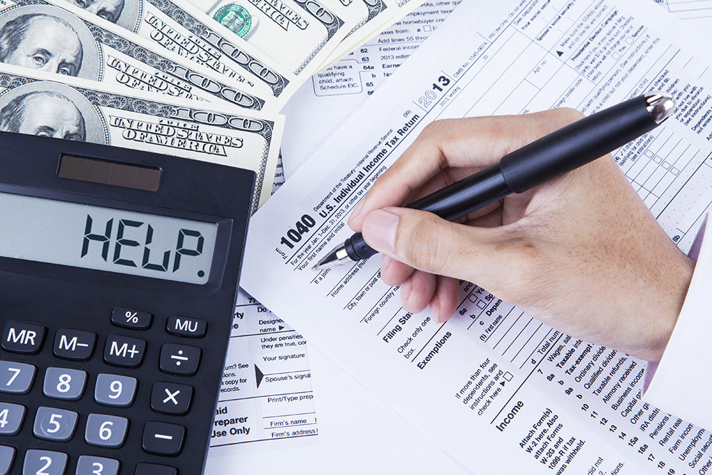 Accountant filling the tax forms - Live Out Loud